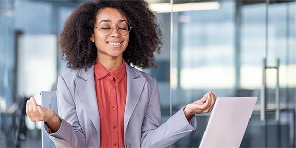 woman meditating at work
