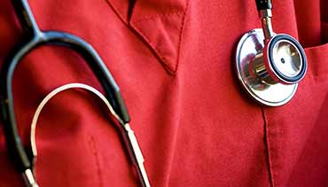 a stethoscope on a nurse's chest