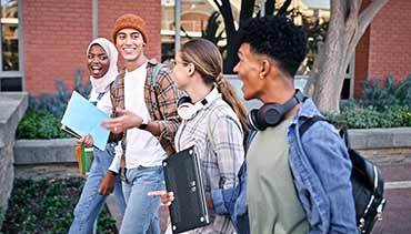 teens walking down a street