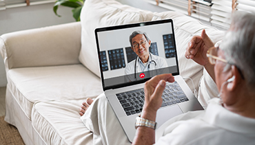 Asian senior video call with doctor telemedicine telehealth concept